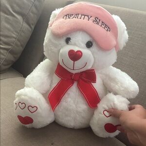White Plush Teddy Bear with Pink Sleep Mask and Red Accents